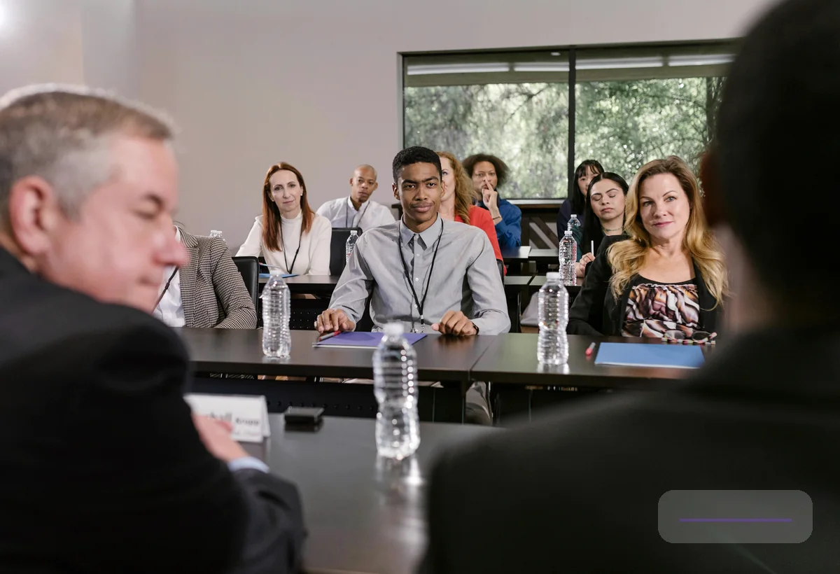 Professionals comparing venue space requirements for a corporate program